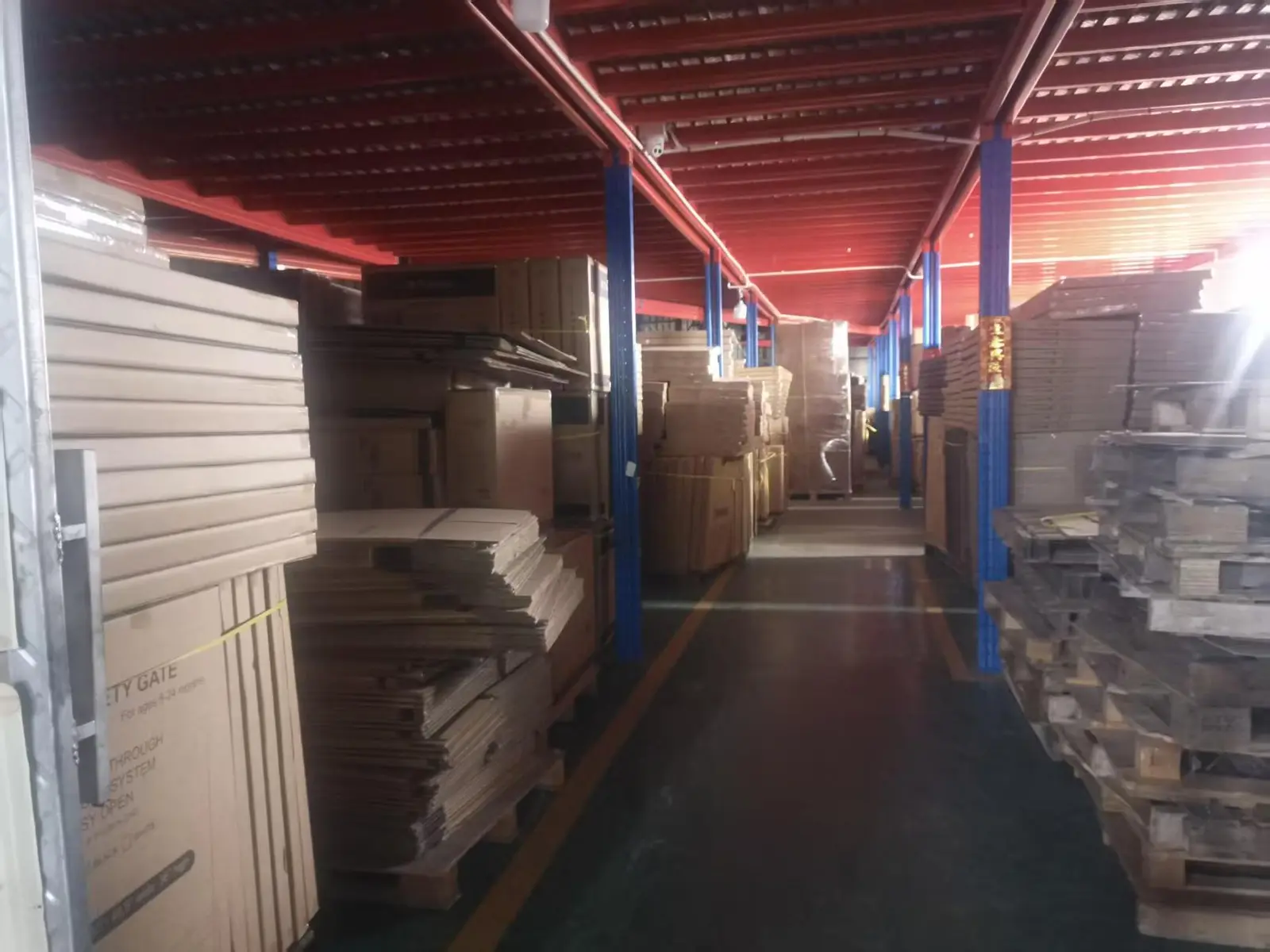 Packaging materials and prepared cartons inside the Jinlang warehouse area